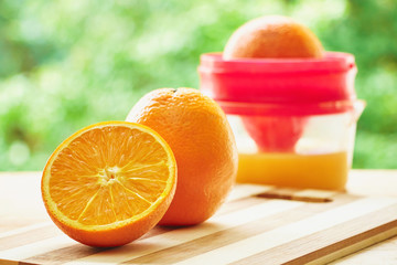 Oranges and juicer