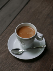 cup of coffee latte on the wood texture