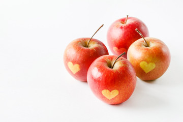 Red apples with a heart symbol
