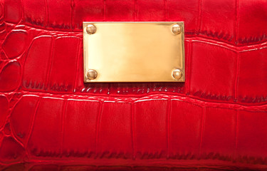 Red leather texture with golden signboard 