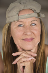 Active fit happy mature woman sporty cap