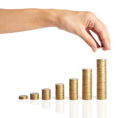 Hand put coins to stack of coins