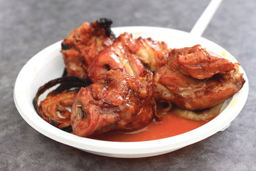 pork kebab on a white plate close-up