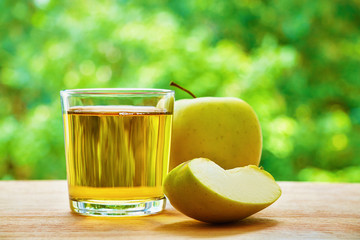 Apple, lobule and glass on the table