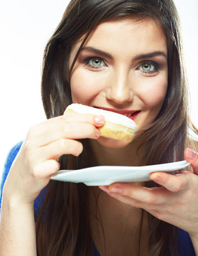 Woman bite donut. Close up portrait of young woman