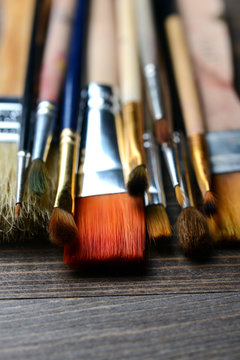 brushes on wood background