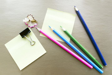crayons and paper for notes on Golden background