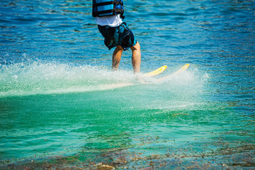 Close up image of unrecognisable man waterskiing over Danube river