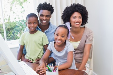 Happy family using the computer