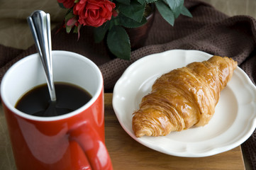 black coffee with croissant