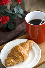 fresh croissant and coffee for breakfast