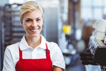 Pretty barista smiling at the camera