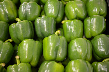 Obraz na płótnie Canvas neatly folded green bell peppers