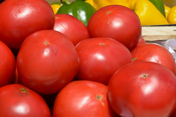 red tomatoes in wooden crates