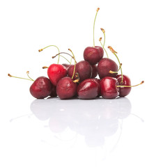 Red cherry fruit over white background