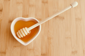 Honey on the bowl with honey dipper