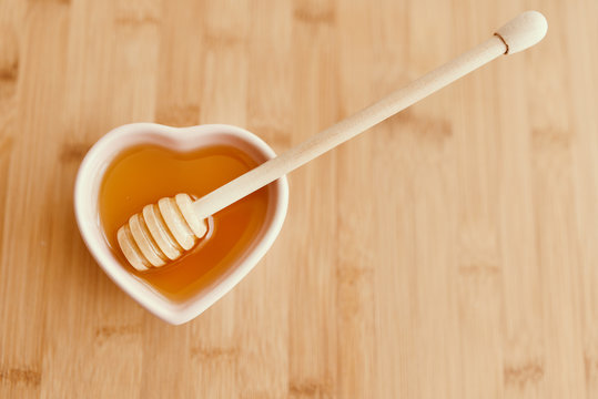Honey on the bowl with honey dipper
