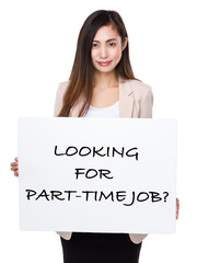 Businesswoman holding a board showing with looking for part-time