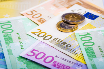 Closeup of euro banknotes and coins