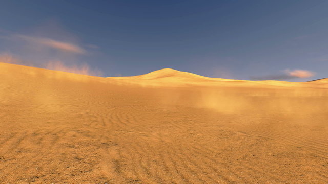 Sunset in a dunes with sand blowing