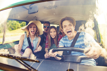 Young hipster friends on road trip