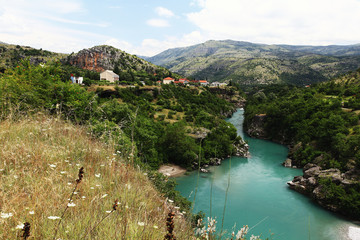 Fototapeta na wymiar mountain landscape with mountain turbulent river in the gorge