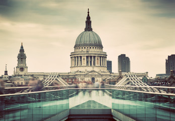 Naklejka premium St Paul's Cathedral dome seen from Millenium Bridge in London, the UK.