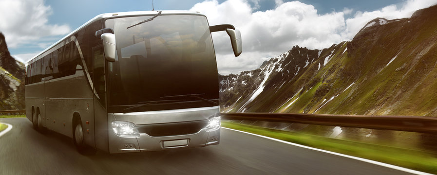 Bus in front of mountain landscape