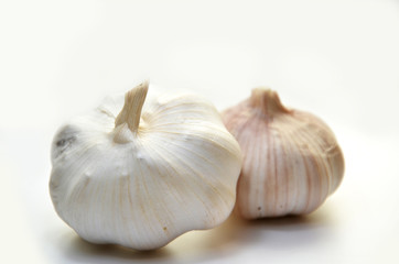 Obraz na płótnie Canvas Two Garlic bulbs