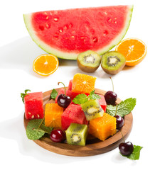 Assortment of sliced fruits on plate