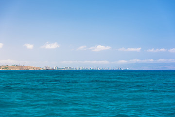Distant city seen from sea