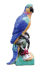 Old figurine. Ceramic figure of a parrot isolated on white.