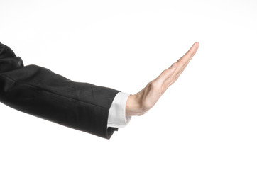 Businessman and gesture topic: a man in a black suit and white shirt showing hand gesture on an isolated white background in studio