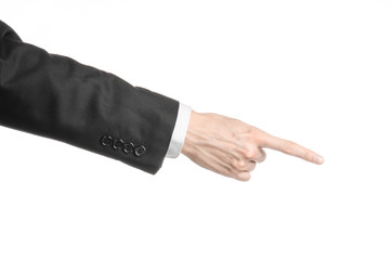 Businessman and gesture topic: a man in a black suit and white shirt showing hand gesture on an isolated white background in studio