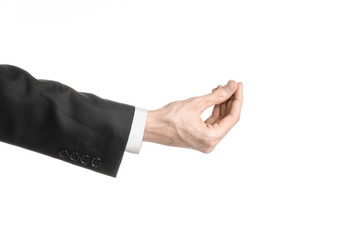 Businessman and gesture topic: a man in a black suit and white shirt showing hand gesture on an isolated white background in studio - 86514690