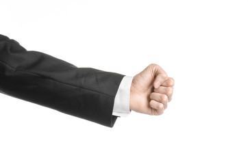 Businessman and gesture topic: a man in a black suit and white shirt showing hand gesture on an isolated white background in studio