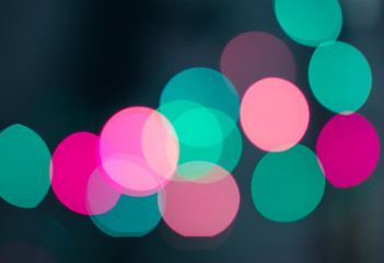 Abstract blurred background and theme: colorful bokeh blurred lights on a dark background