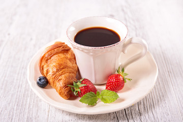 coffee cup and croissant