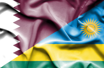 Waving flag of Rwanda and Qatar