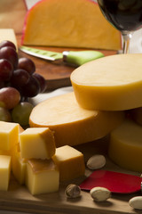 Different cheeses on a cutting board, delicious food