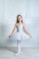 A little adorable young ballerina isposing on camera in the inte © jutaphoto