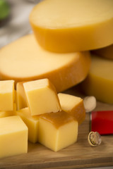 Different cheeses on a cutting board, delicious food