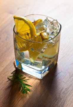 alcoholic drink with lemon and ice