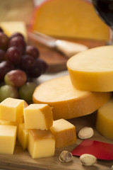 Different cheeses on a cutting board, delicious food