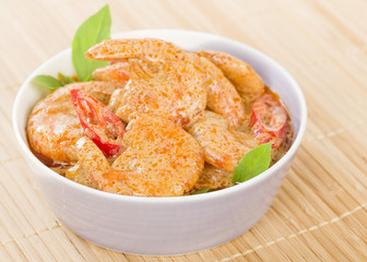 Thai Prawn Curry - King prawns in red curry sauce and coconut milk in a lilac bowl.