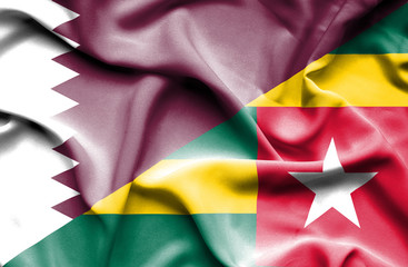 Waving flag of Togo and Qatar