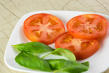 Basil and cut tomatoes.