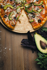 delicious pizza in composition with fresh vegetables