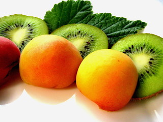 kiwi and apricot separately on a white background