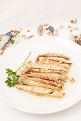 Dish of roasted mackerels.
